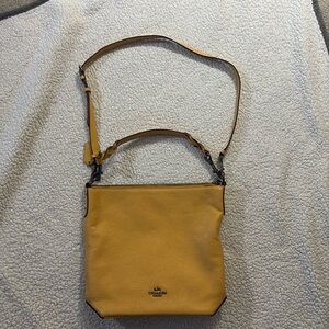 Coach crossbody bucket bag, mustard color